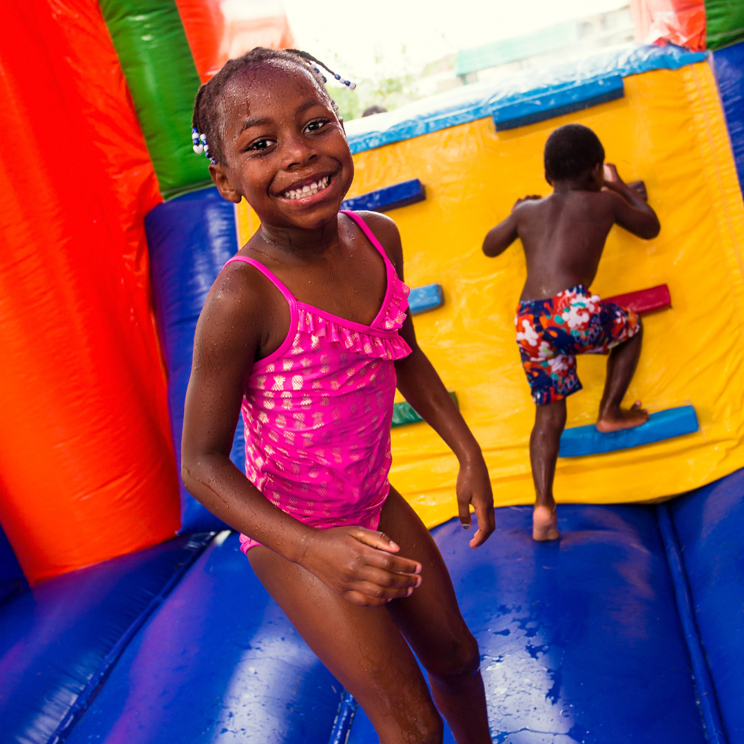 Dual lane water slide rental at a summer party in Northwest Georgia